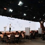 Made in Russia- Conference hall with speakers and attendees at an international business forum
