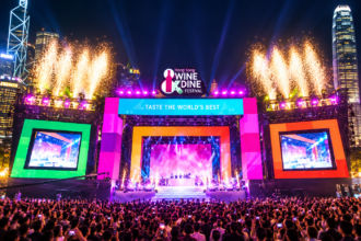 Hong Kong Wine Dine Festival stage illuminated with colourful lights, fireworks and a large audience at night
