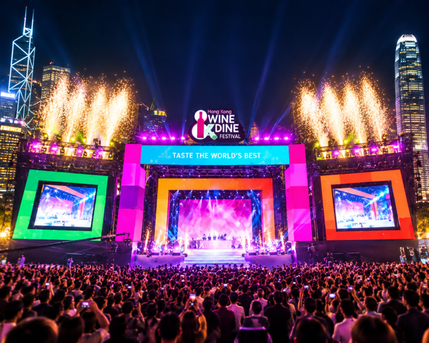 Hong Kong Wine Dine Festival stage illuminated with colourful lights, fireworks and a large audience at night