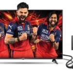 Power+ LED TV displaying cricket players beside an electrical outlet and power plug