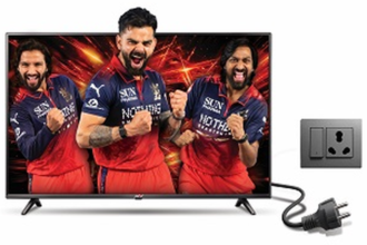 Power+ LED TV displaying cricket players beside an electrical outlet and power plug