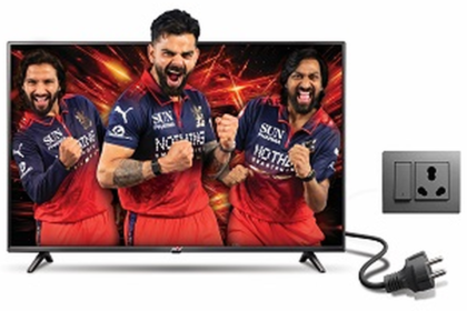 Power+ LED TV displaying cricket players beside an electrical outlet and power plug