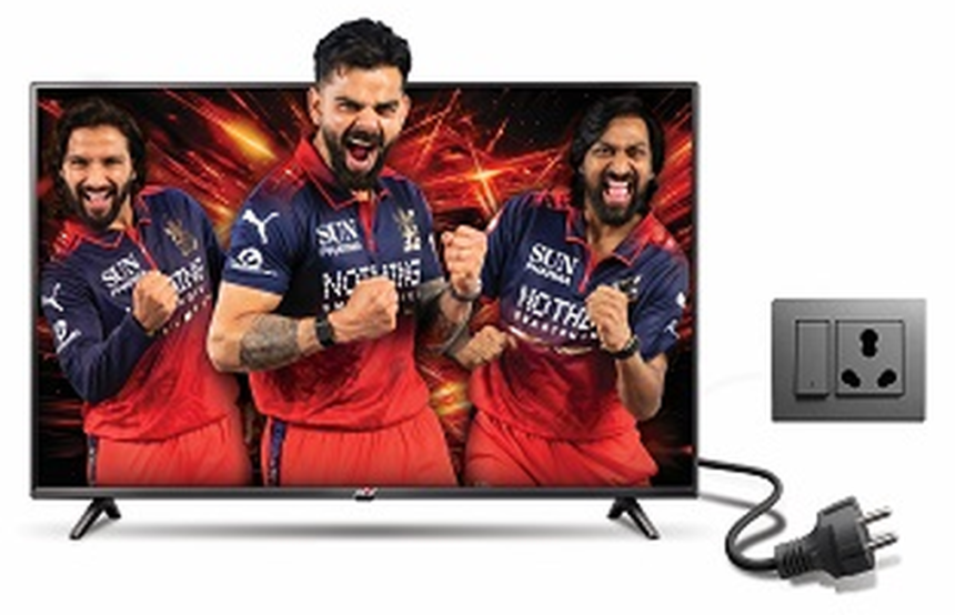 Power+ LED TV displaying cricket players beside an electrical outlet and power plug