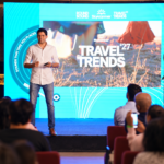 Neel Ghose presenting Skyscanner Travel Trends 2027 on stage