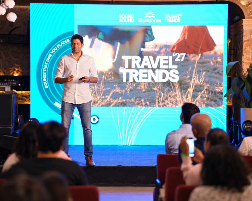 Neel Ghose presenting Skyscanner Travel Trends 2027 on stage