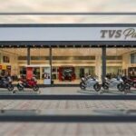 TVS Paddock premium motorcycle showroom exterior with motorcycles displayed outside